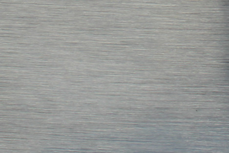 Harjattu metalli tarra